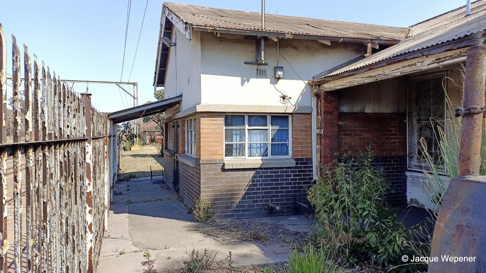 A building with a brick wall and a brick wall AI-generated content may be incorrect.