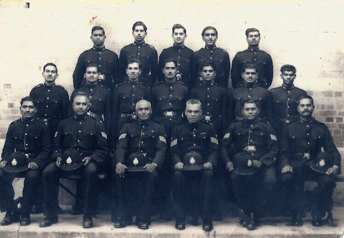 A group of men in uniform AI-generated content may be incorrect.