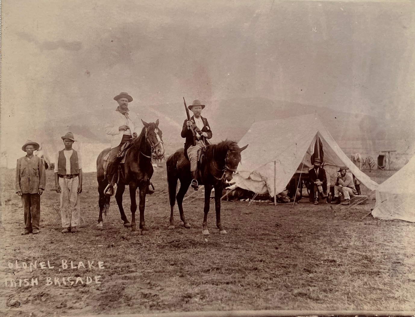 A group of men on horses in a field AI-generated content may be incorrect.