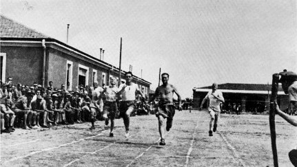 A group of men running on a track AI-generated content may be incorrect.