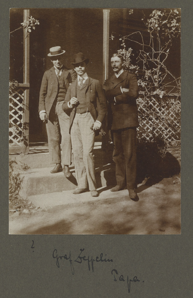 A group of men standing outside a house AI-generated content may be incorrect.
