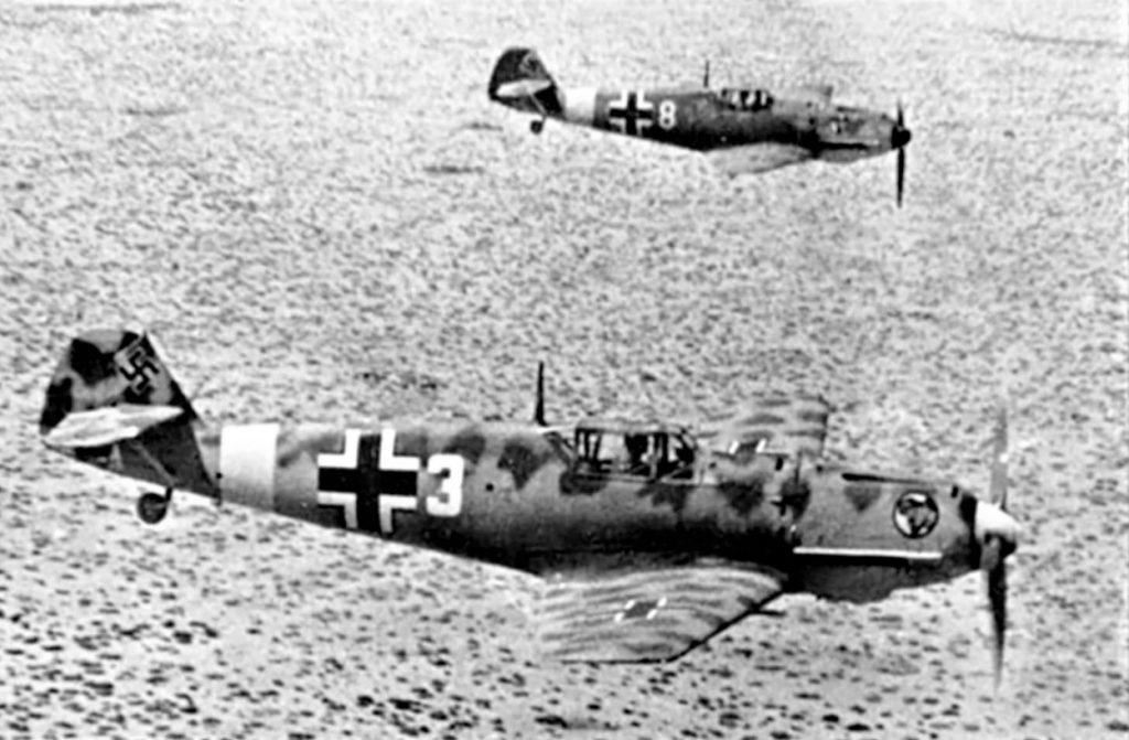 A group of military planes flying over water AI-generated content may be incorrect.