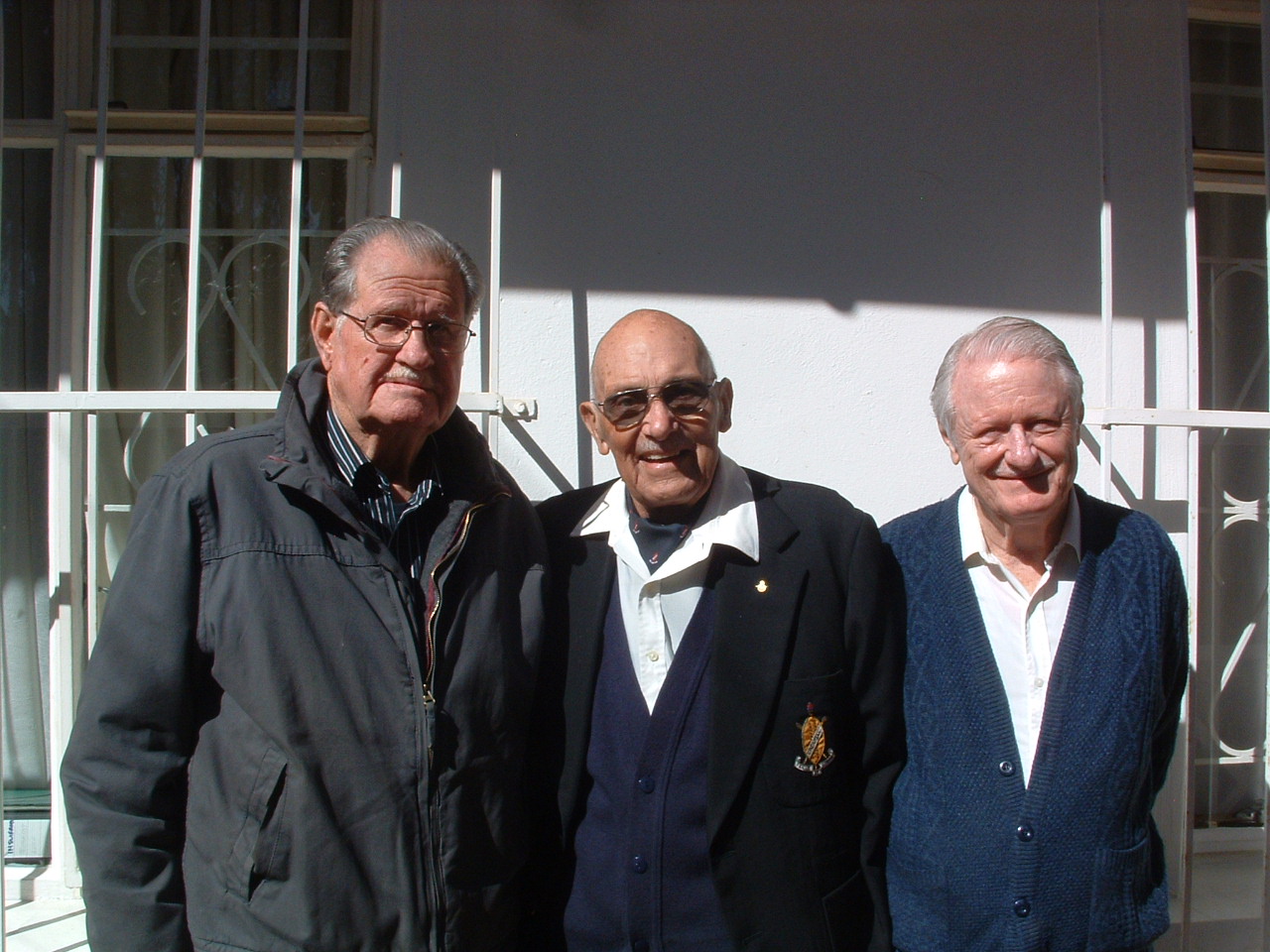 A group of old men standing together

AI-generated content may be incorrect.