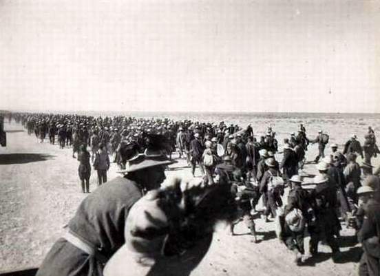 A group of people marching in a field AI-generated content may be incorrect.