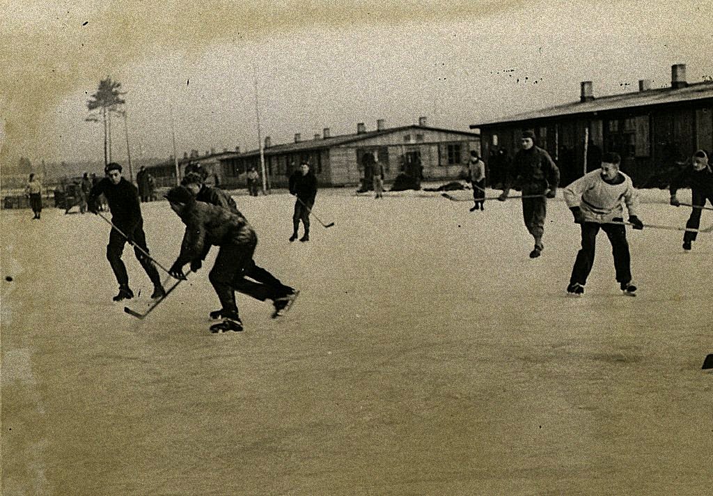A group of people playing hockey AI-generated content may be incorrect.