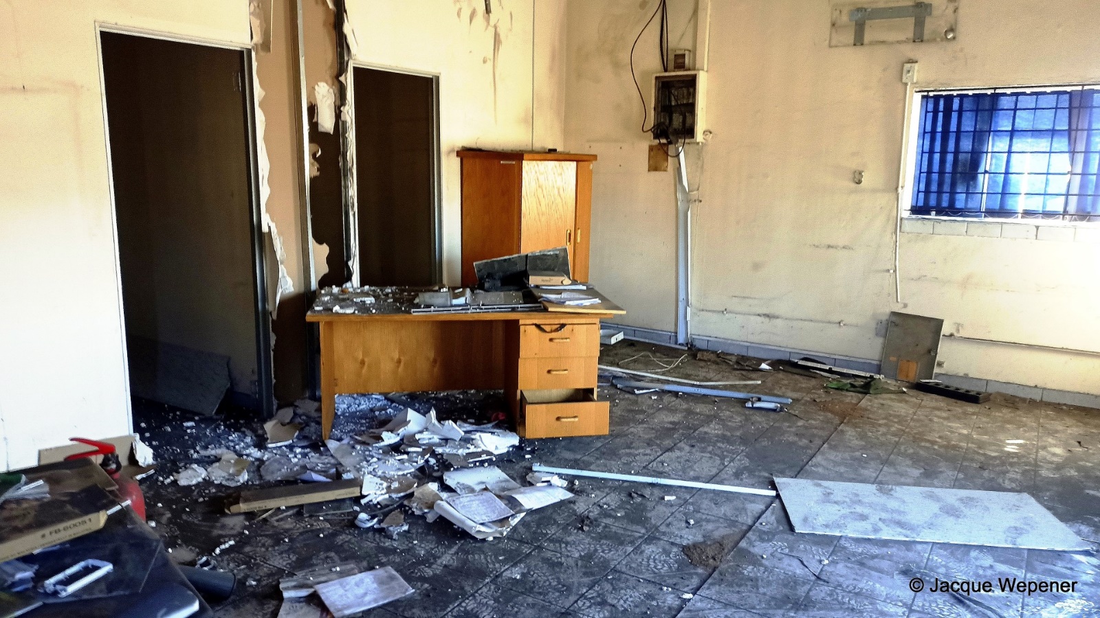 A nice room with a desk and broken glass AI-generated content may be incorrect.