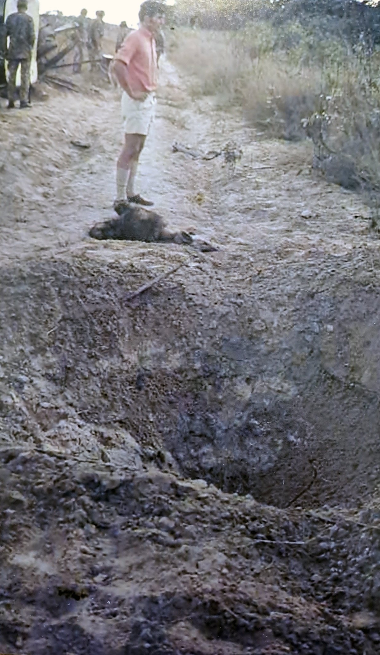 A person standing in the dirt AI-generated content may be incorrect.