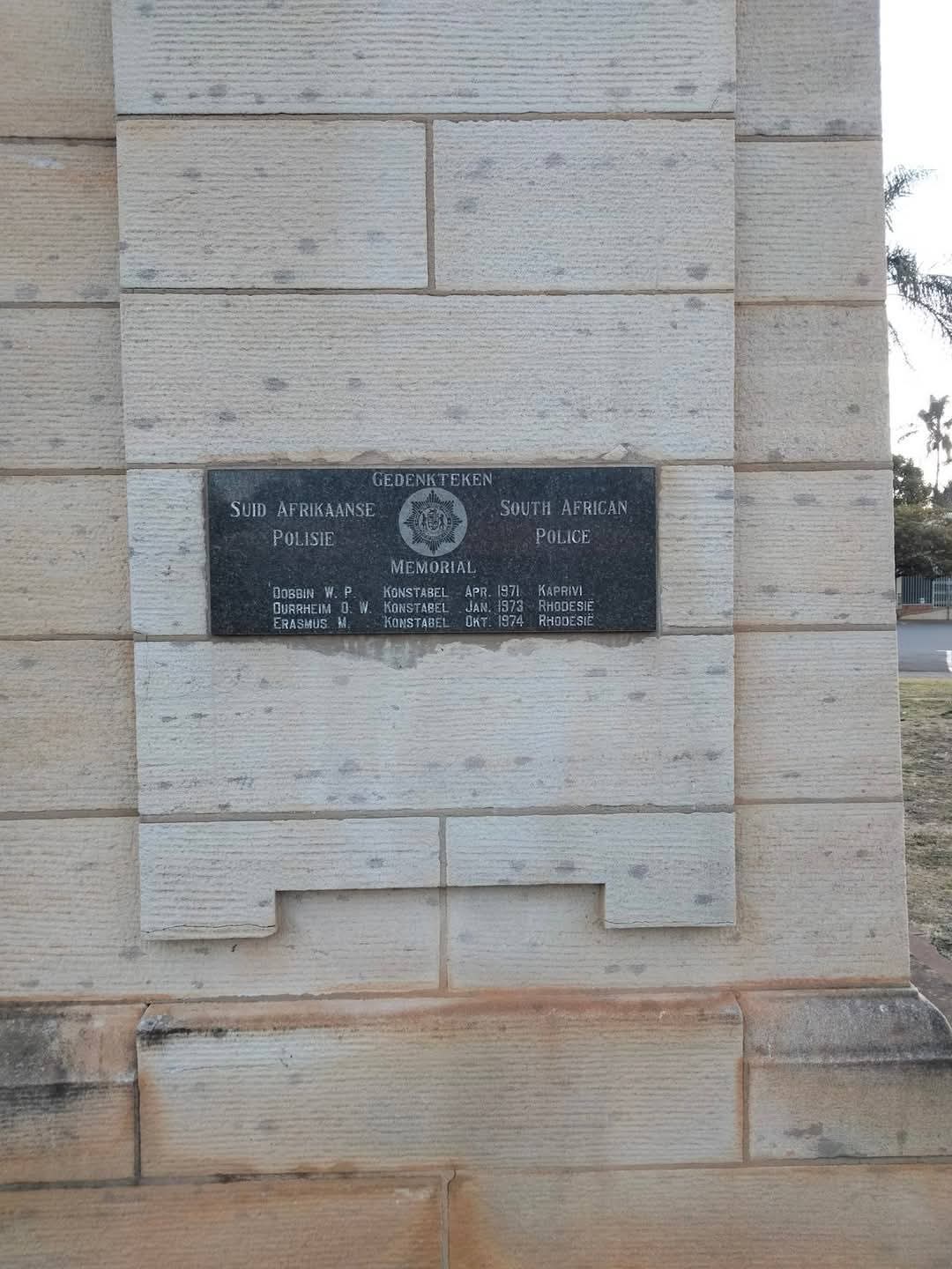 A plaque on a stone wall

AI-generated content may be incorrect.