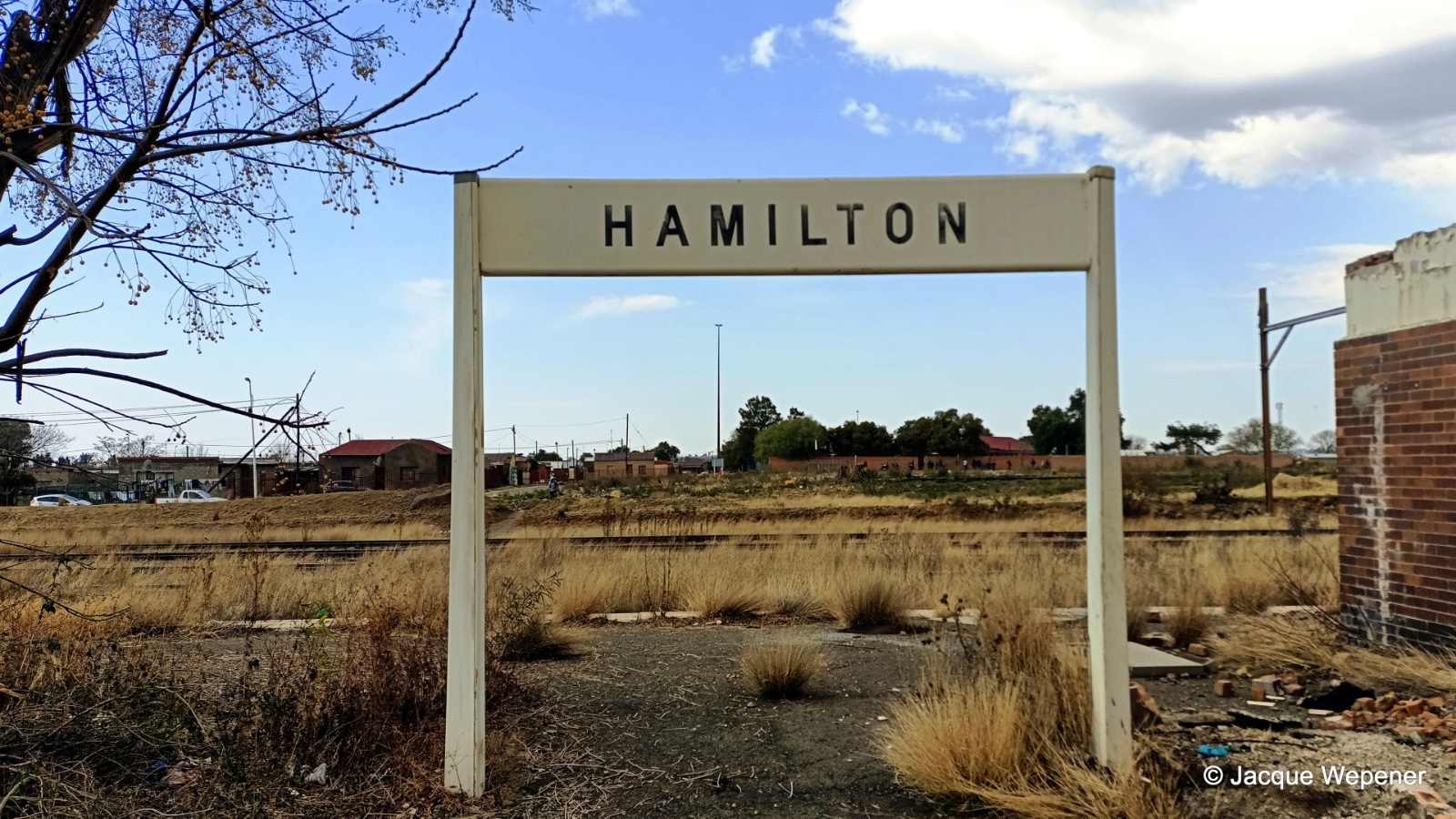 A sign in a field AI-generated content may be incorrect.