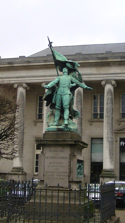 A statue of a person holding a flag AI-generated content may be incorrect.