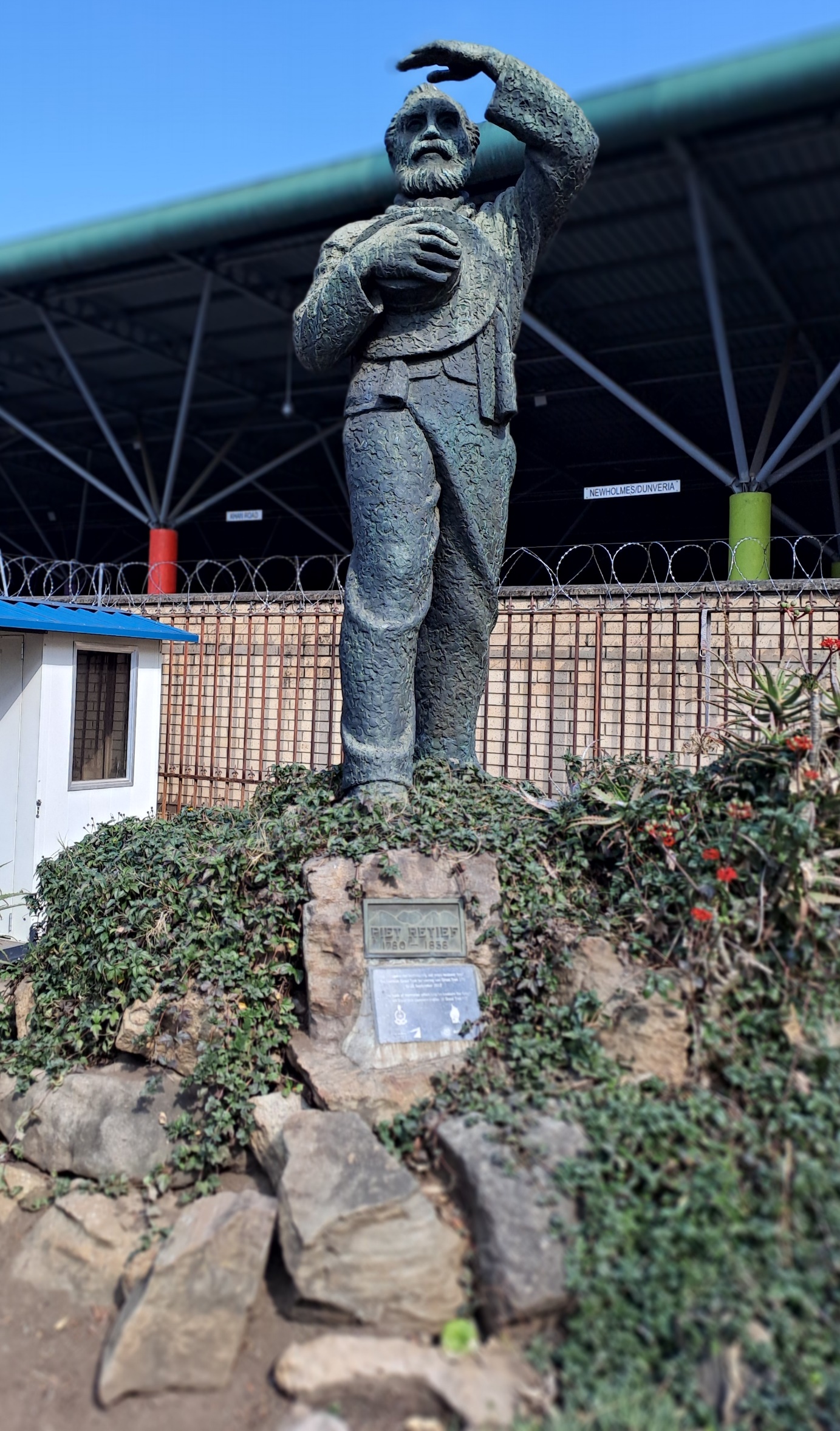 A statue of a person on a rock AI-generated content may be incorrect.