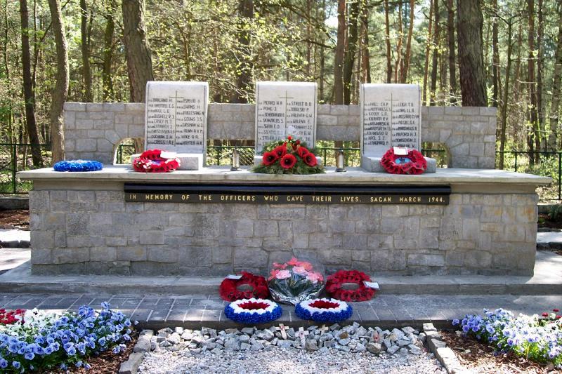 A stone memorial with flowers AI-generated content may be incorrect.