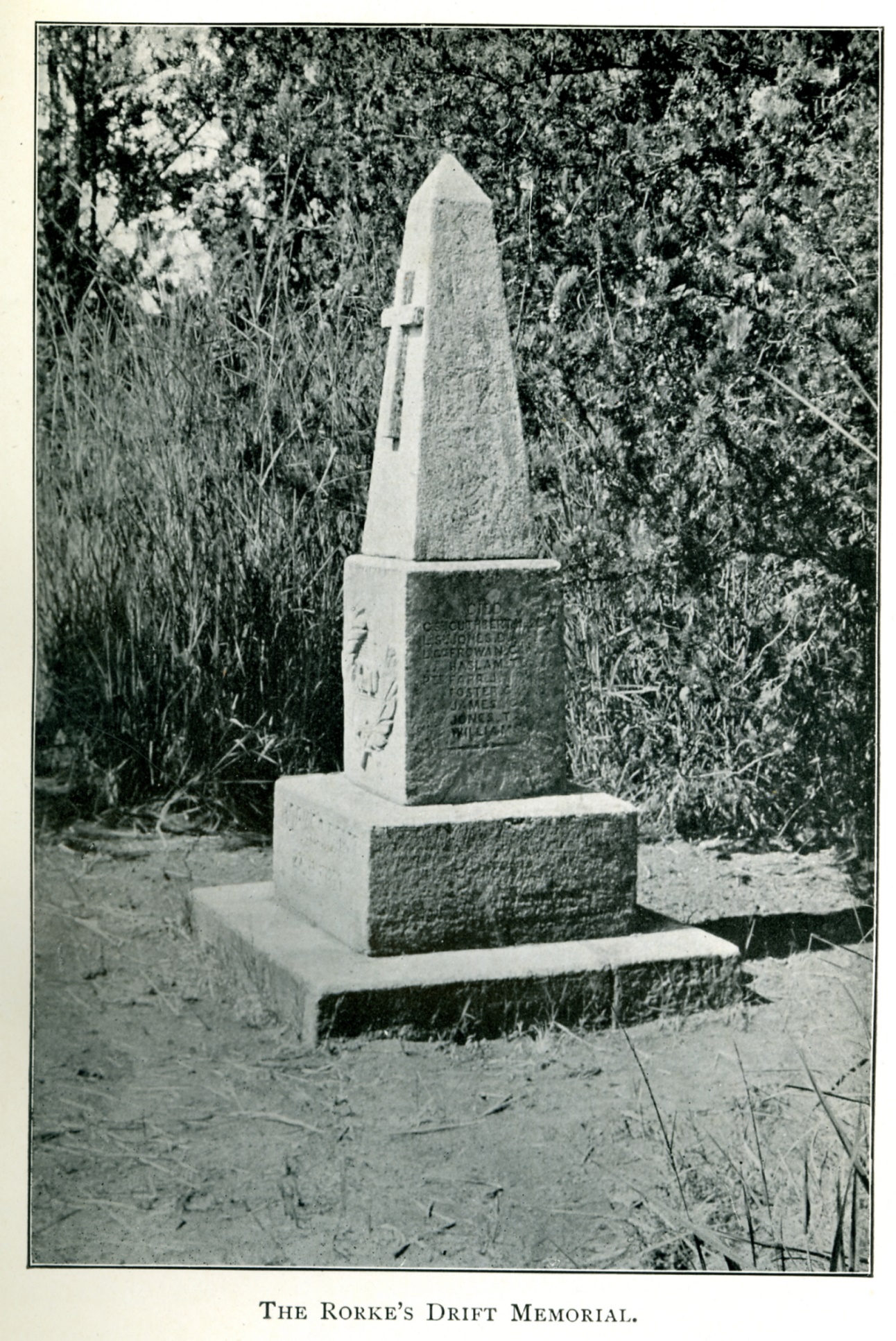 A stone monument with a cross on top

AI-generated content may be incorrect.