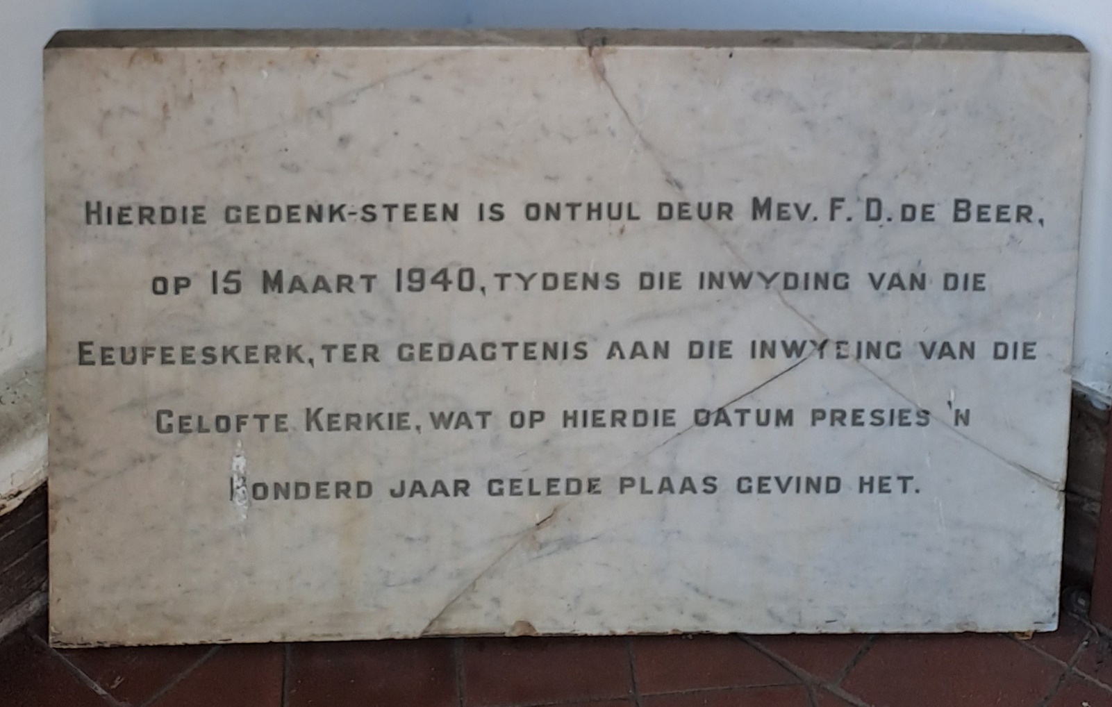 A stone plaque with text on it AI-generated content may be incorrect.