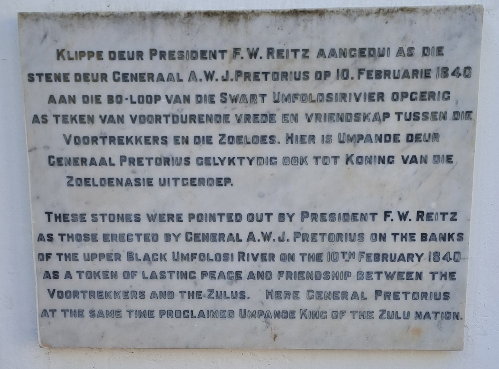 A stone plaque with text on it AI-generated content may be incorrect.
