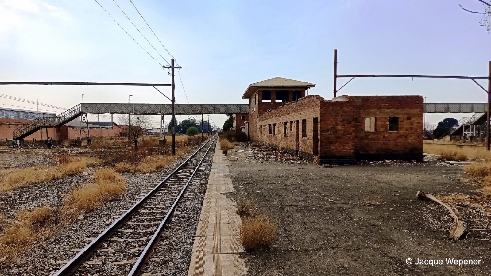 A train tracks next to a building AI-generated content may be incorrect.