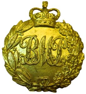 A gold medallion with a crown and leaves

AI-generated content may be incorrect.