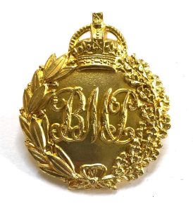 A gold medallion with a crown and letters

AI-generated content may be incorrect.
