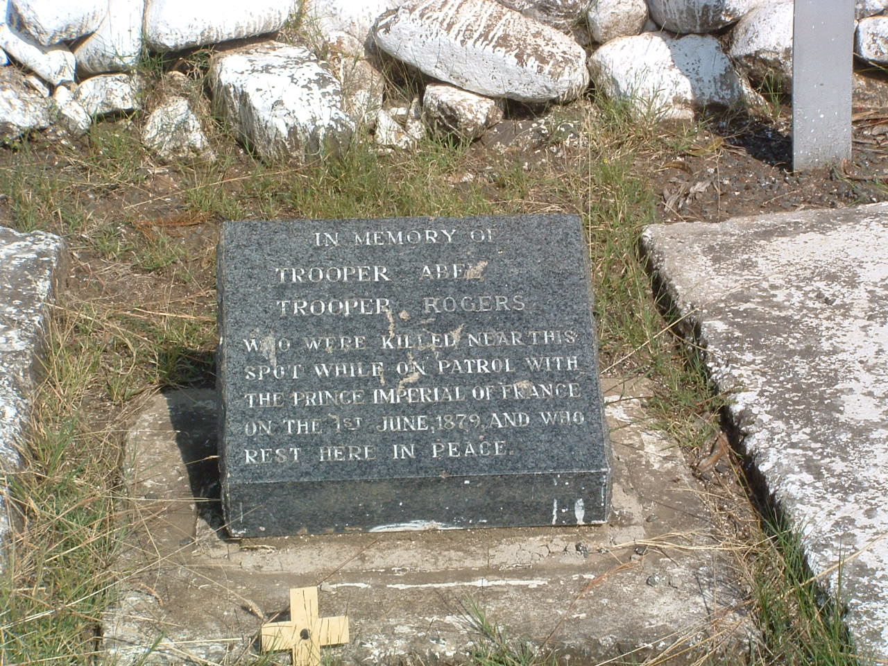 A grave stone with a cross

AI-generated content may be incorrect.