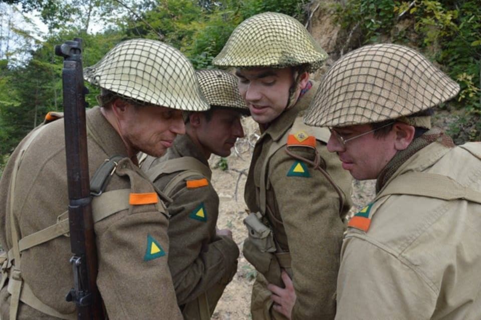 A group of men in military uniforms

AI-generated content may be incorrect.