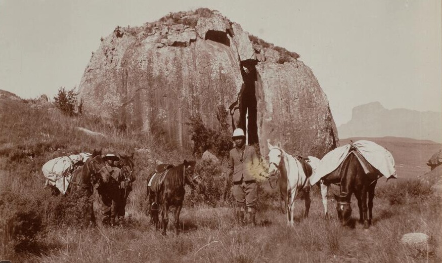 A group of people standing next to a rock

AI-generated content may be incorrect.