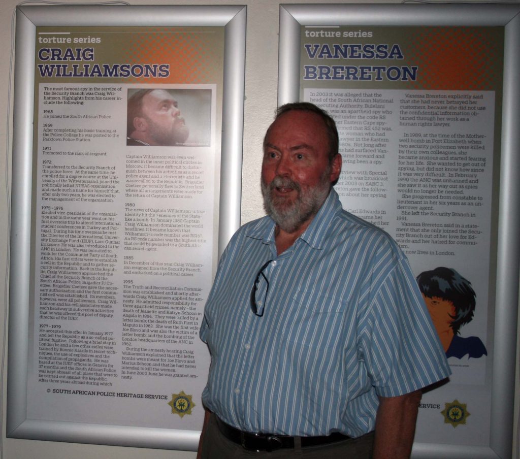 A person standing in front of a poster AI-generated content may be incorrect.