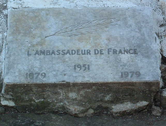 A stone with writing on it

AI-generated content may be incorrect.