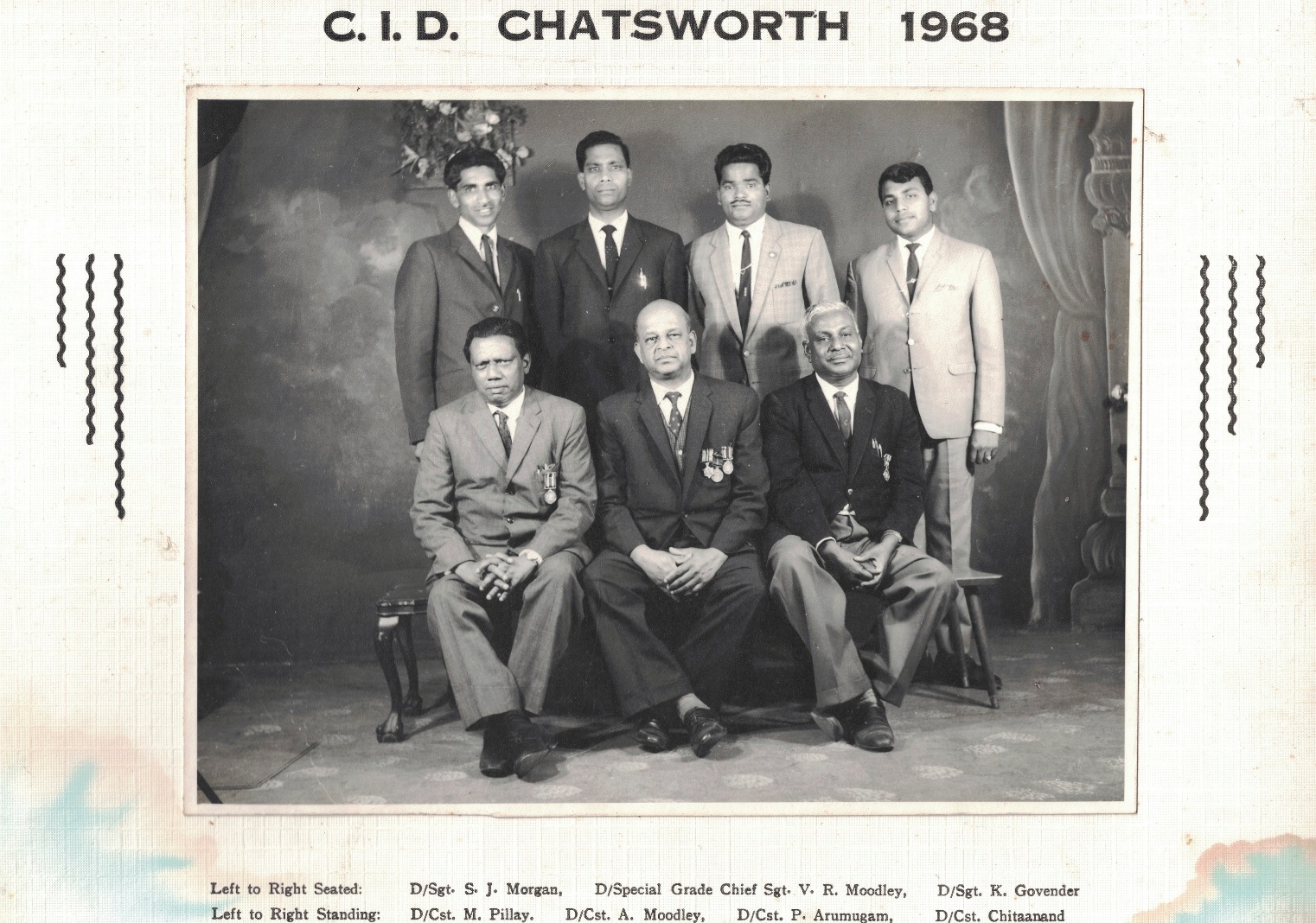 A group of men posing for a photo AI-generated content may be incorrect.