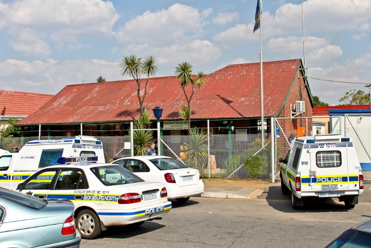 A group of police cars parked outside a building AI-generated content may be incorrect.