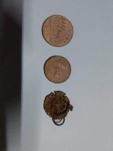 A few coins on a table
AI-generated content may be incorrect.