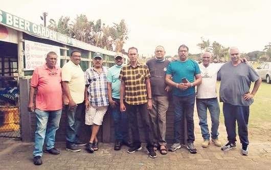 A group of men standing together AI-generated content may be incorrect.