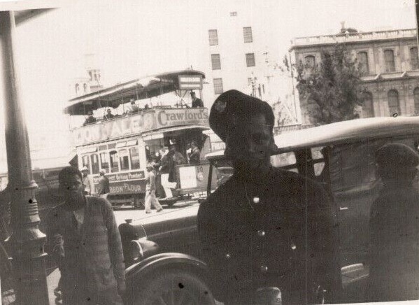 A person standing next to a car AI-generated content may be incorrect.