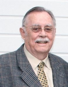 A person wearing a suit and tie AI-generated content may be incorrect.