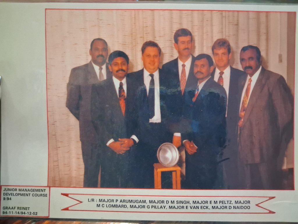 A group of men in suits AI-generated content may be incorrect.