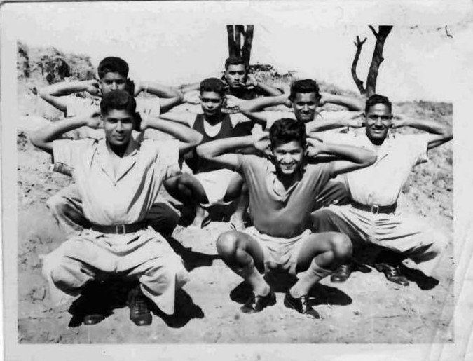 A group of men kneeling in the dirt

AI-generated content may be incorrect.