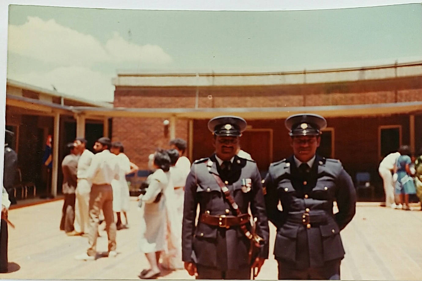 A group of people in uniform AI-generated content may be incorrect.