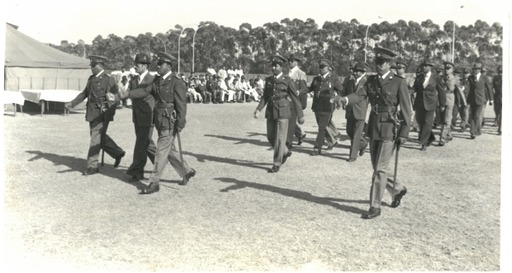 A group of people marching in military uniforms

AI-generated content may be incorrect.