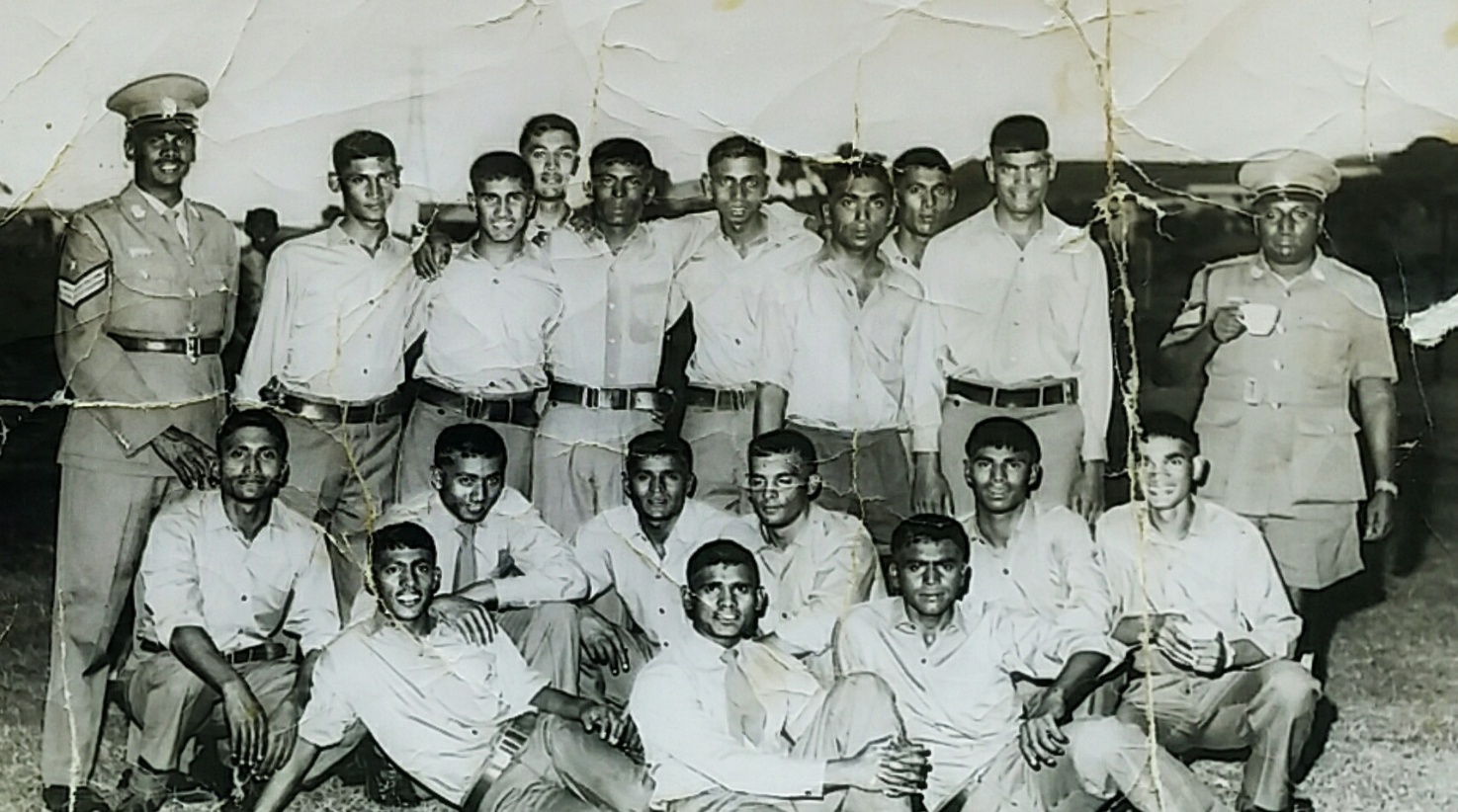 A group of men posing for a photo AI-generated content may be incorrect.