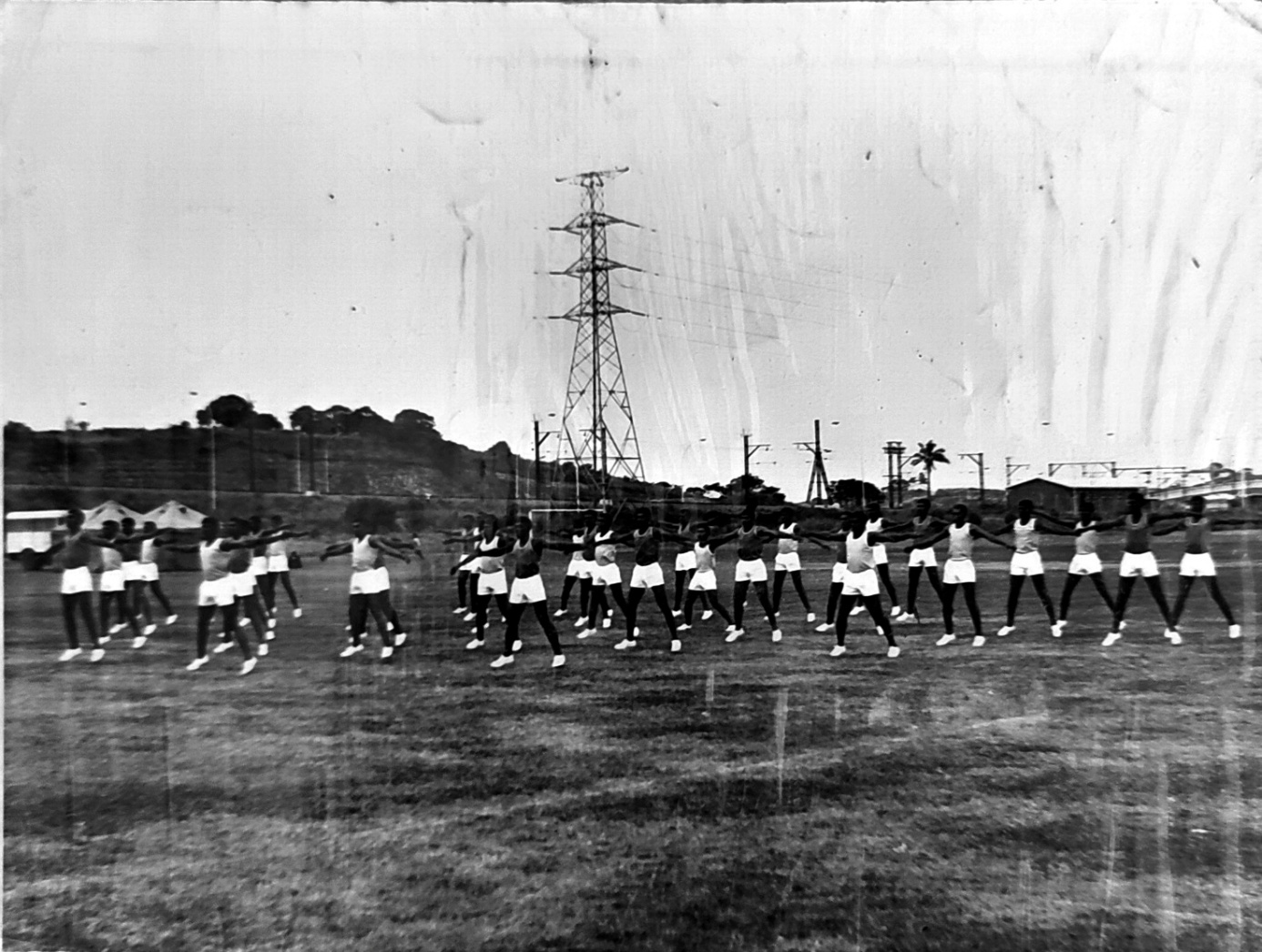 A group of people marching on a field AI-generated content may be incorrect.