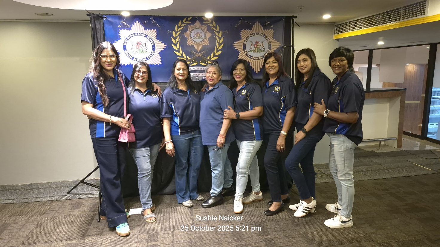 A group of women posing for a photo
AI-generated content may be incorrect.