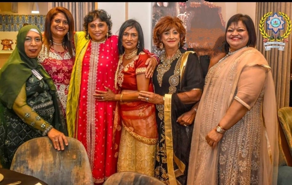 A group of women posing for a photo
AI-generated content may be incorrect.