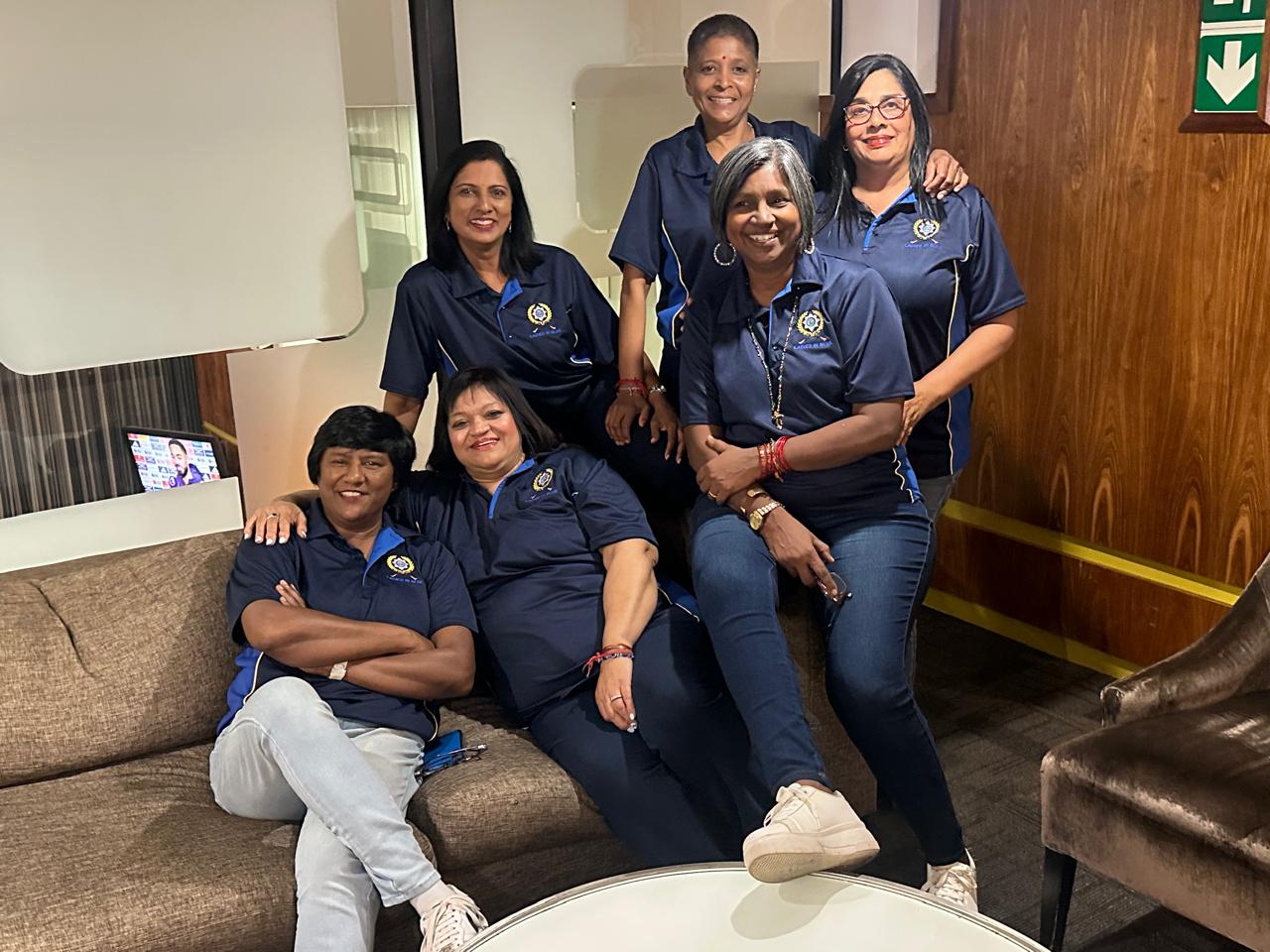 A group of women posing for a photo
AI-generated content may be incorrect.