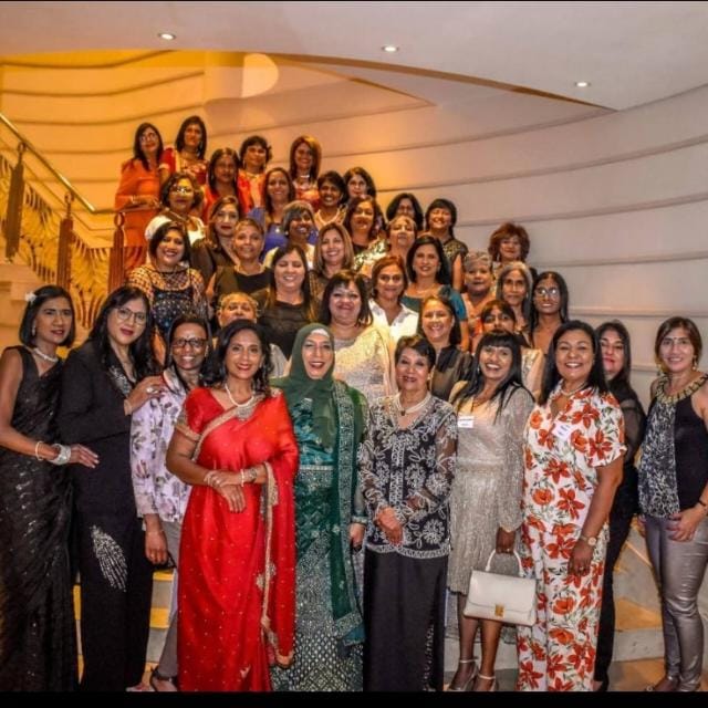 A group of women posing for a photo
AI-generated content may be incorrect.