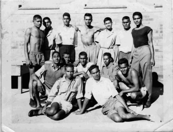 A group of young men posing for a photo
AI-generated content may be incorrect.