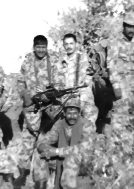 A group of men in camouflage AI-generated content may be incorrect.