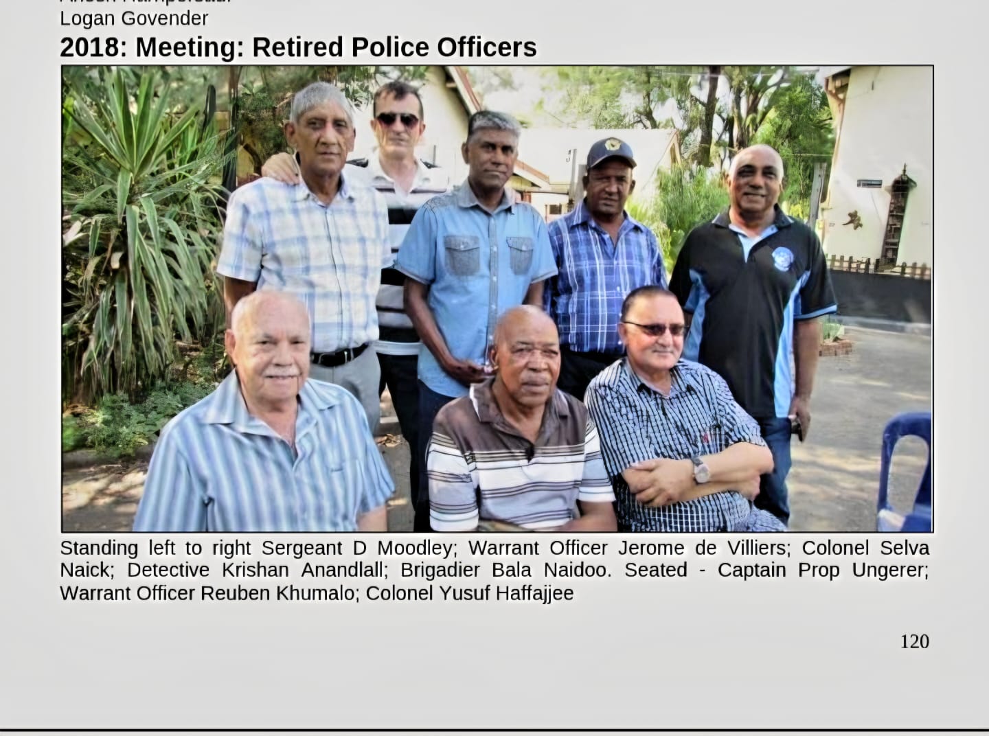 A group of men posing for a photo AI-generated content may be incorrect.