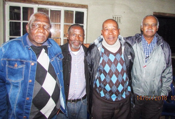 A group of men standing together

AI-generated content may be incorrect.