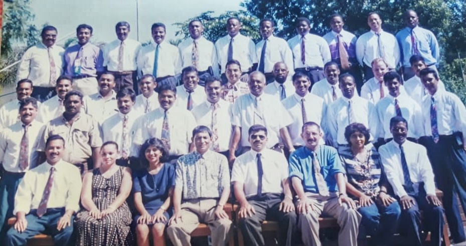 A group of people posing for a photo AI-generated content may be incorrect.