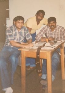 A group of men sitting at a table
AI-generated content may be incorrect.