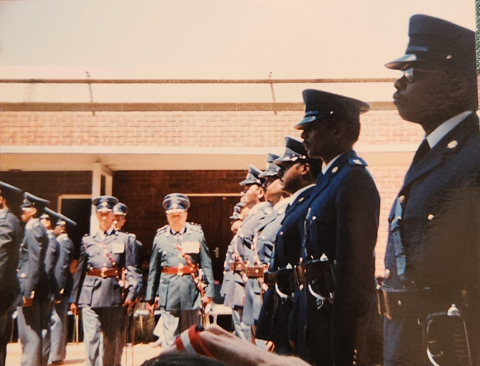 A group of people in uniform standing in a row
AI-generated content may be incorrect.